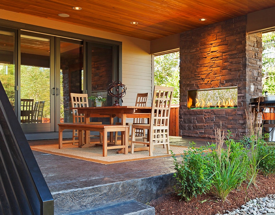 Majestic Lanai 48 outdoor fireplace with stone kit surround on dining patio
