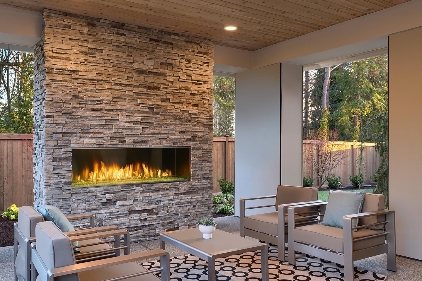 Majestic Lanai 60 linear gas fireplace on covered outdoor patio with stacked stone