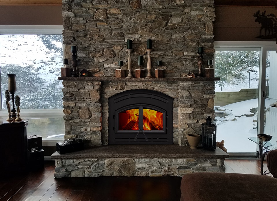 Majestic WarmMajic II freestanding gas stove in dark paneled elegant interior